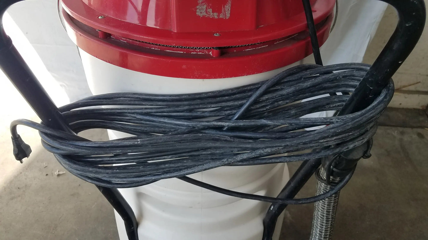 Surtec system c72f1 red and white wet dry vacuum cleaner with coiled black power cord wrapped around handle