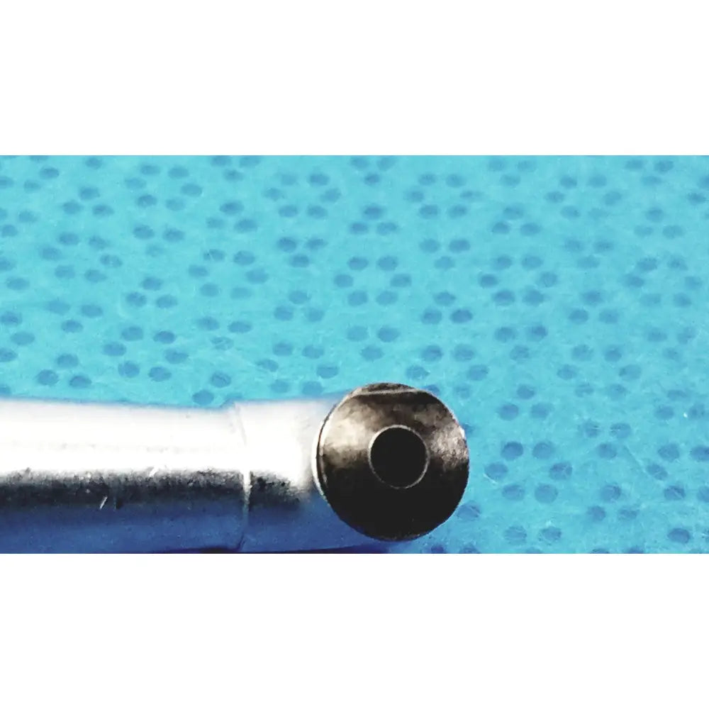 Silver metallic pen tip with circular worn end cap on sybronendo 18 to 1 axxess spring-head handpiece model 815-9016