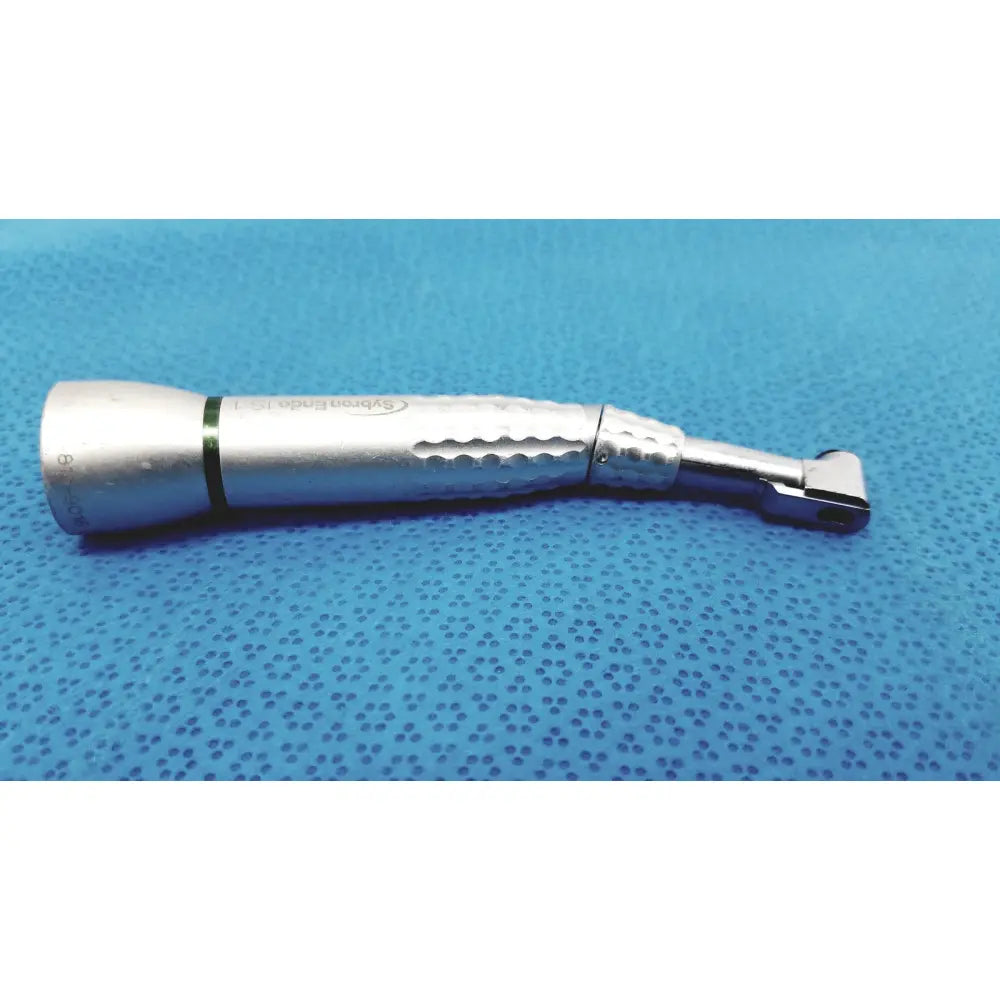 Silver sybronendo axxess spring-head handpiece with textured grip and engraved branding for dental use