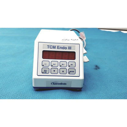 White plastic sybronendo tcm endo iii medical device with red digital display and control buttons labeled tcm endo iii