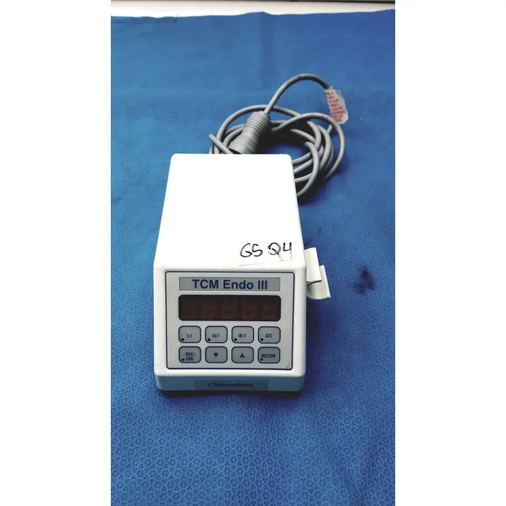 White plastic sybronendo tcm endo iii medical device with digital display and control buttons for endodontic use