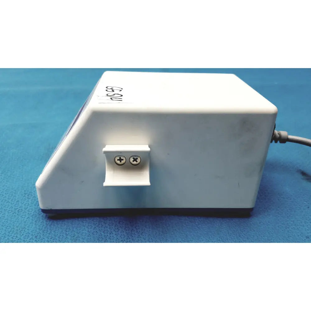 White rectangular sybronendo tcm endo iii device with two circular terminals on a small protruding panel back side
