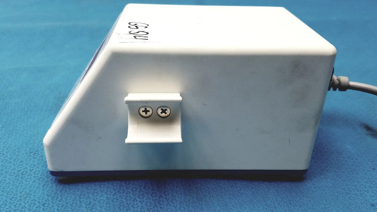 White rectangular sybronendo tcm endo iii device with two circular terminals on a small protruding panel back side