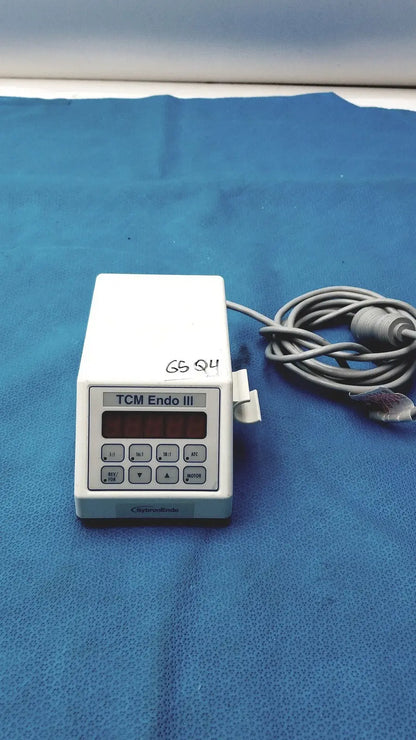 White plastic sybronendo tcm endo iii medical device with digital display and control buttons for endodontic use
