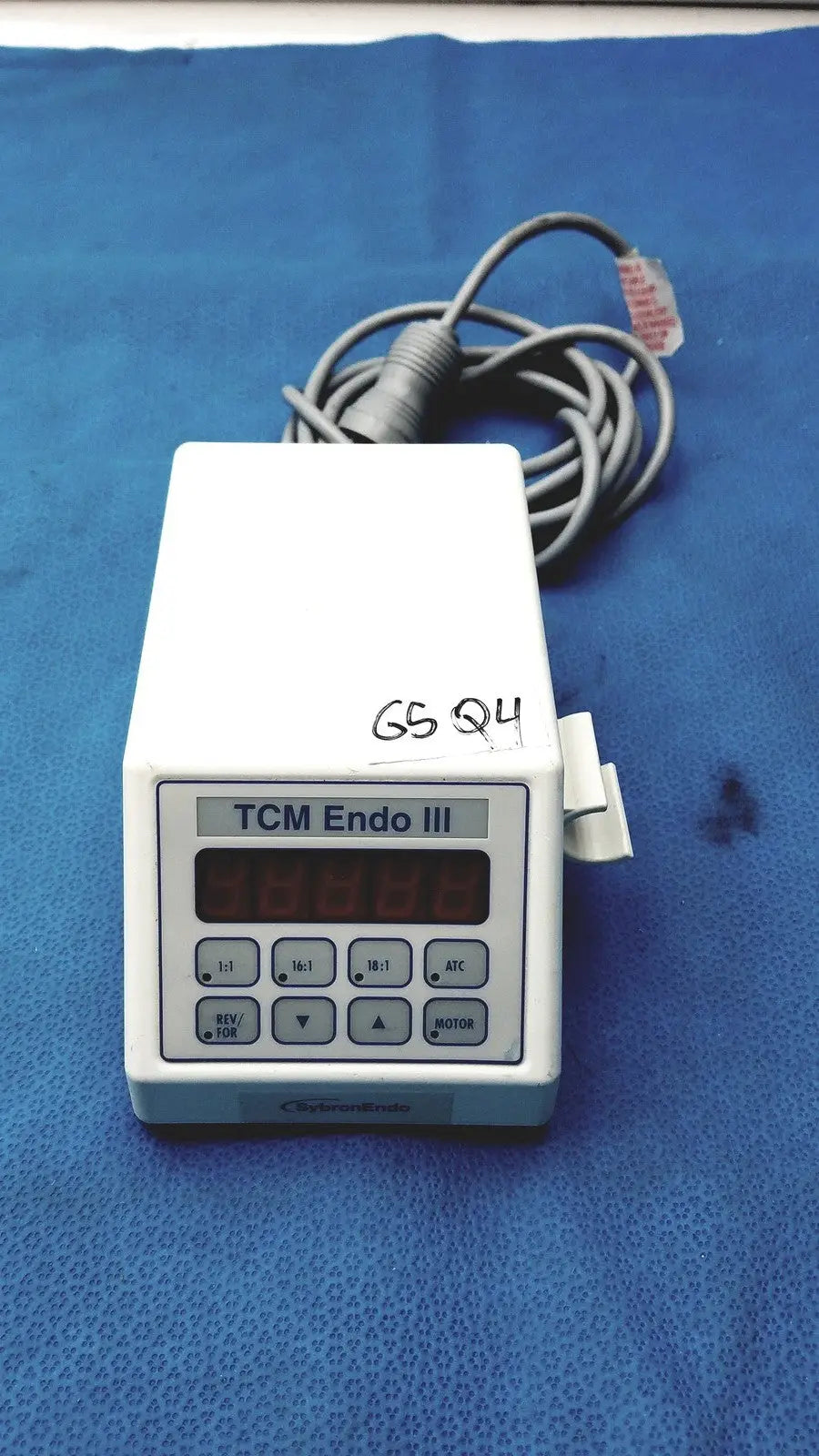 White plastic sybronendo tcm endo iii medical device with digital display and control buttons for endodontic use