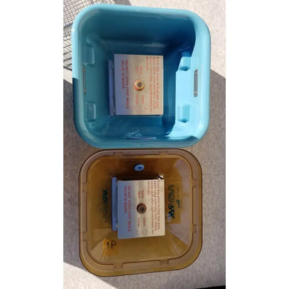 Light blue and tan plastic symmetry medical flashpak 9020 sterilization container system with circular valve on lid