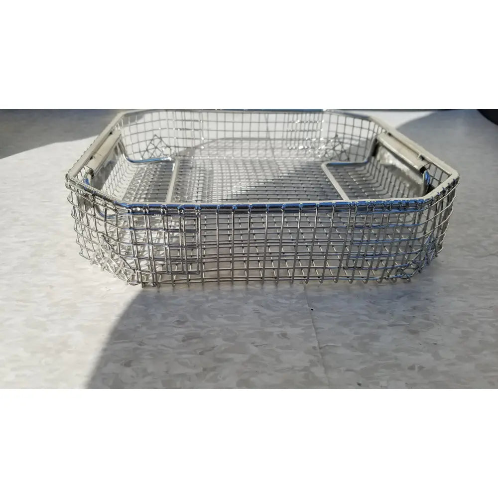 Rectangular stainless steel mesh basket with reinforced edges and handles for symmetry medical flashpak sterilization system