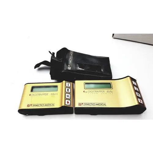 Gold-colored synectics digitrapper 4mb digital pulse oximeter with black accents and small rectangular screen by synectics medical