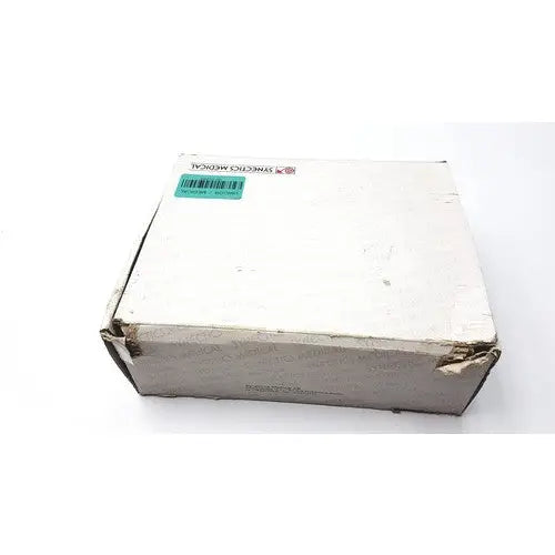 White cardboard box of synectics digitrapper 4mb with green barcode sticker and synthetic medical label for reuse medical use