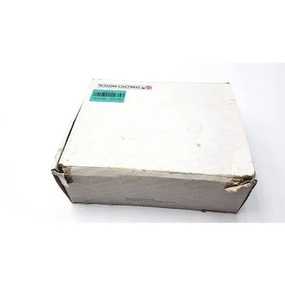 White cardboard box of synectics digitrapper 4mb with green barcode sticker and synthetic medical label for reuse medical use
