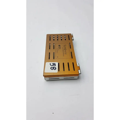 Orange metallic synovis gem precision instrument microtray case with vertical slits and silver hinges branded syngenta