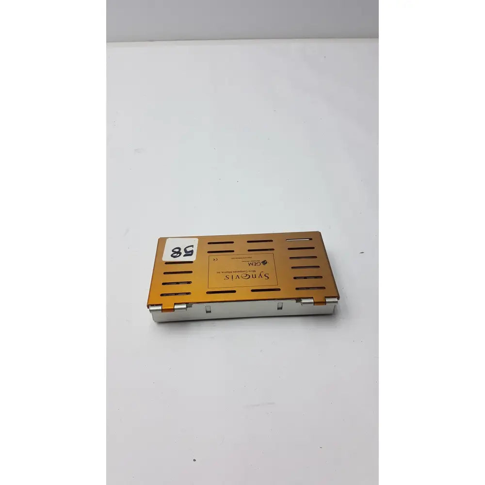 Orange metallic synovis gem precision surgical instrument microtray organizer case with silver hinge and ventilation slots