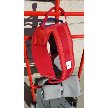 Red padded support vest with gray interior and blue straps for romedic return7500 sit to stand manual lift aid