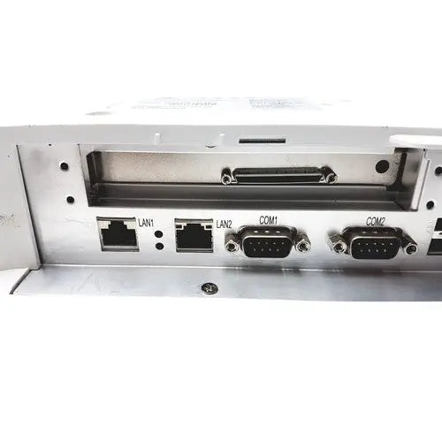 Silver metallic industrial chassis of tangent medical panel pc model c22 with lan1 lan2 and com1 com2 ports backside view