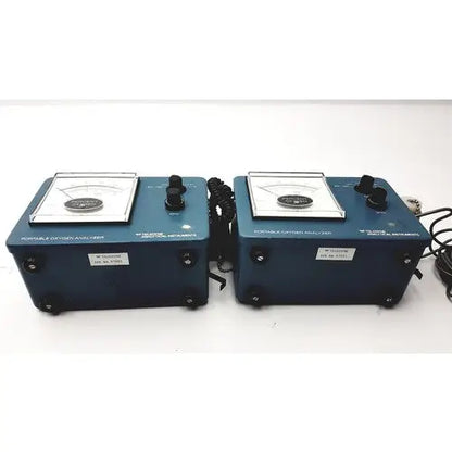 Blue teledyne portable oxygen analyzers with black knobs and coiled cords as portable oxygen analyzer devices