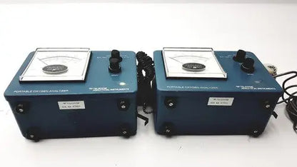 Blue teledyne portable oxygen analyzers with black knobs and coiled cords as portable oxygen analyzer devices
