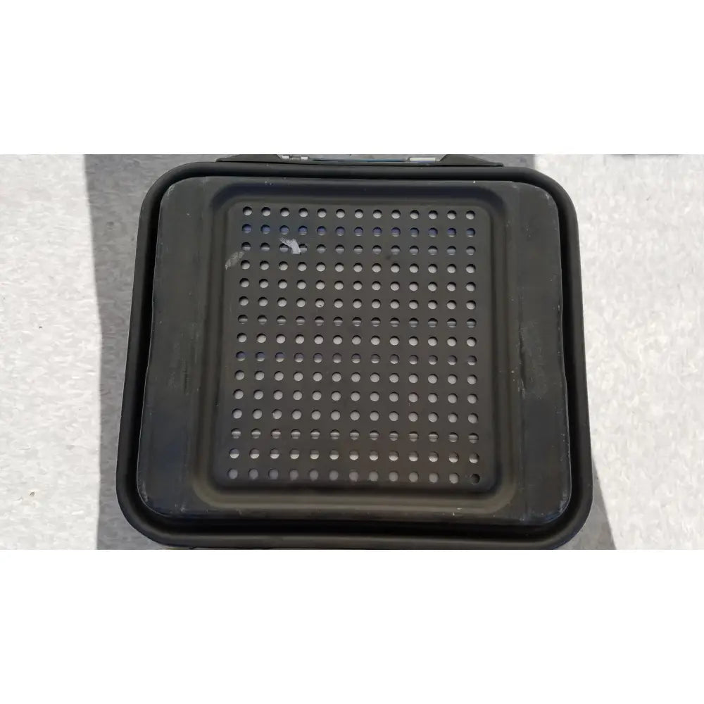 Black plastic grilling tray with circular holes for use in the case genesis sterilization container with basket