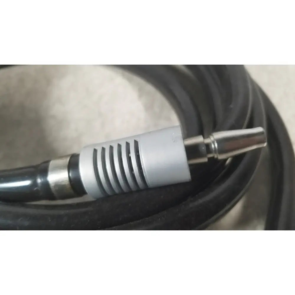 Silver rca connector with black cable and ribbed housing from the case genuis serial no 9354 patent pending product