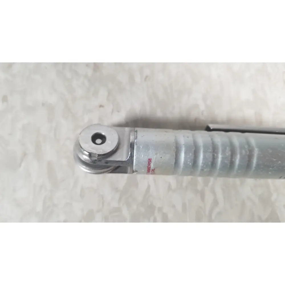 Silver metallic pen with textured grip and circular clip from the case genuis serial no 9354 patent pending collection