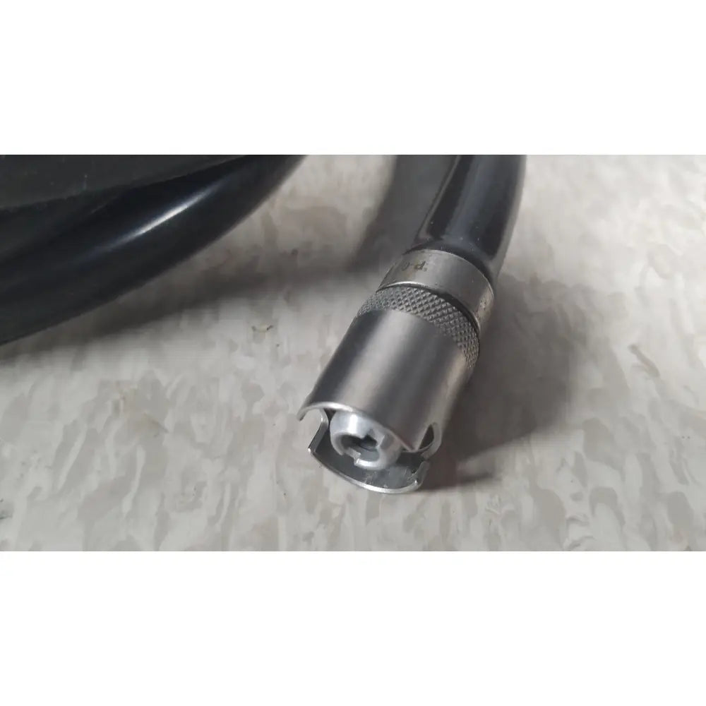 Black cable with silver metallic knurled grip and hexagonal socket connector for case genuis serial no 9354 patent pending