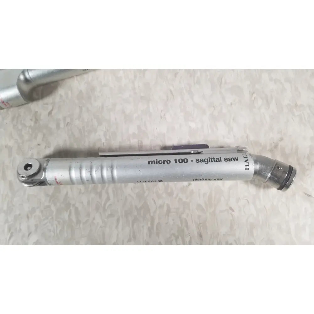 Silver metallic micro 100 sagittal surgical saw by halle in case genuis serial no 9354 patent pending product