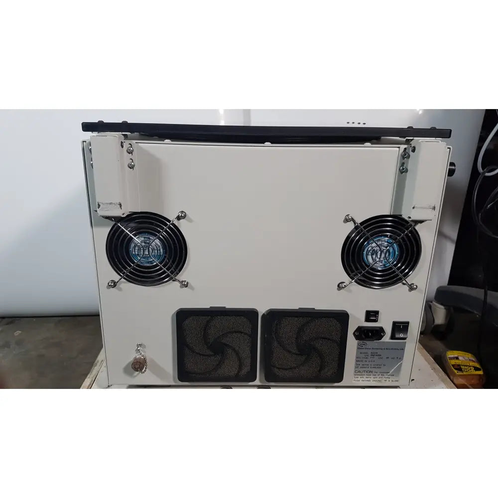 White industrial-grade cooling unit with two black fans and ventilation grilles for the silent solution silencer 2210 centrifuge system