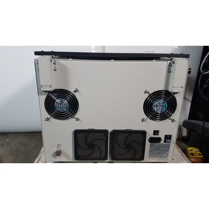 White industrial-grade cooling unit with two black fans and ventilation grilles for the silent solution silencer 2210 centrifuge system