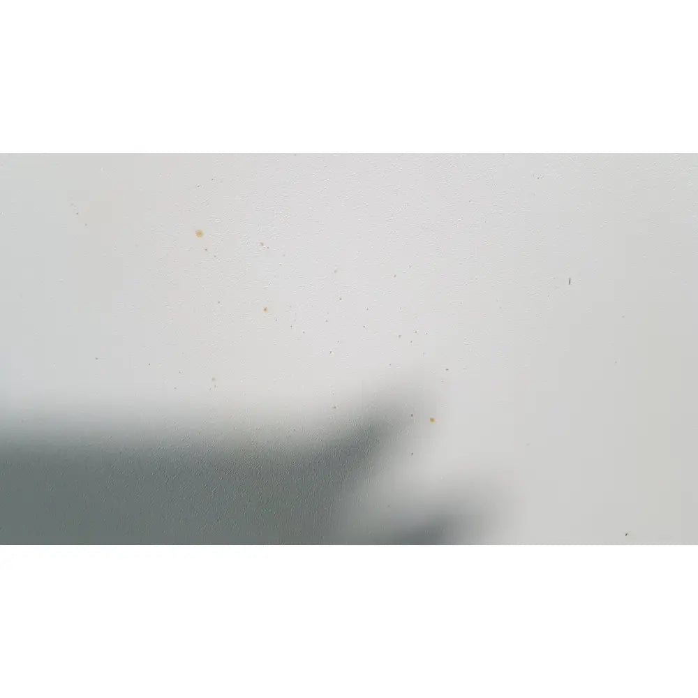 A blurry dark gray hand shadow giving a thumbs-up illustrating the silent solution silencer 2210 centrifuge system