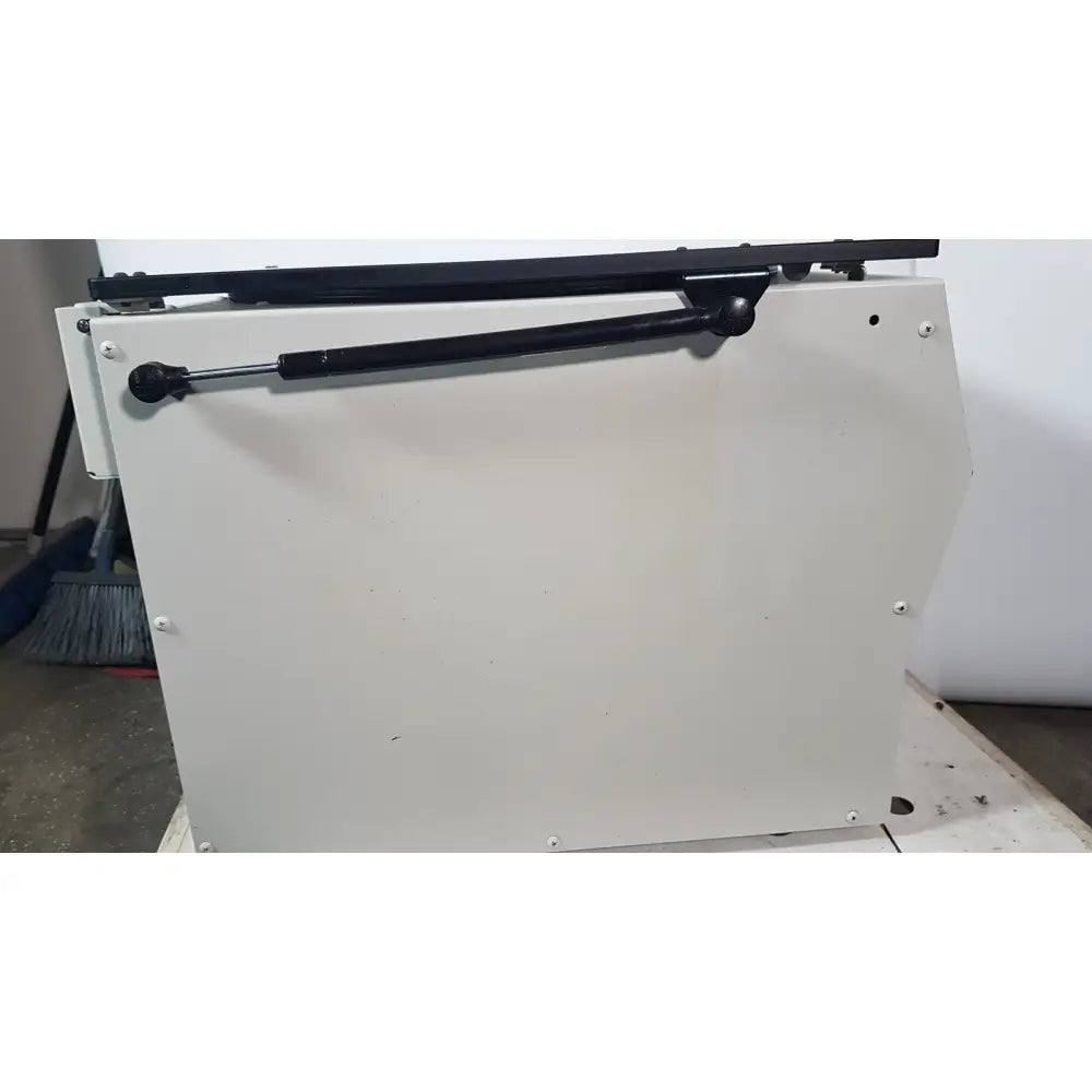 White metal cabinet with black gas spring support for the silent solution silencer 2210 centrifuge system