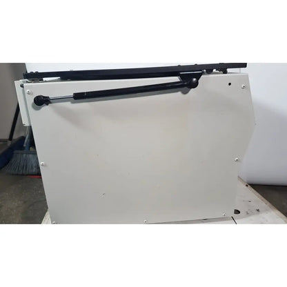 White metal cabinet with black gas spring support for the silent solution silencer 2210 centrifuge system