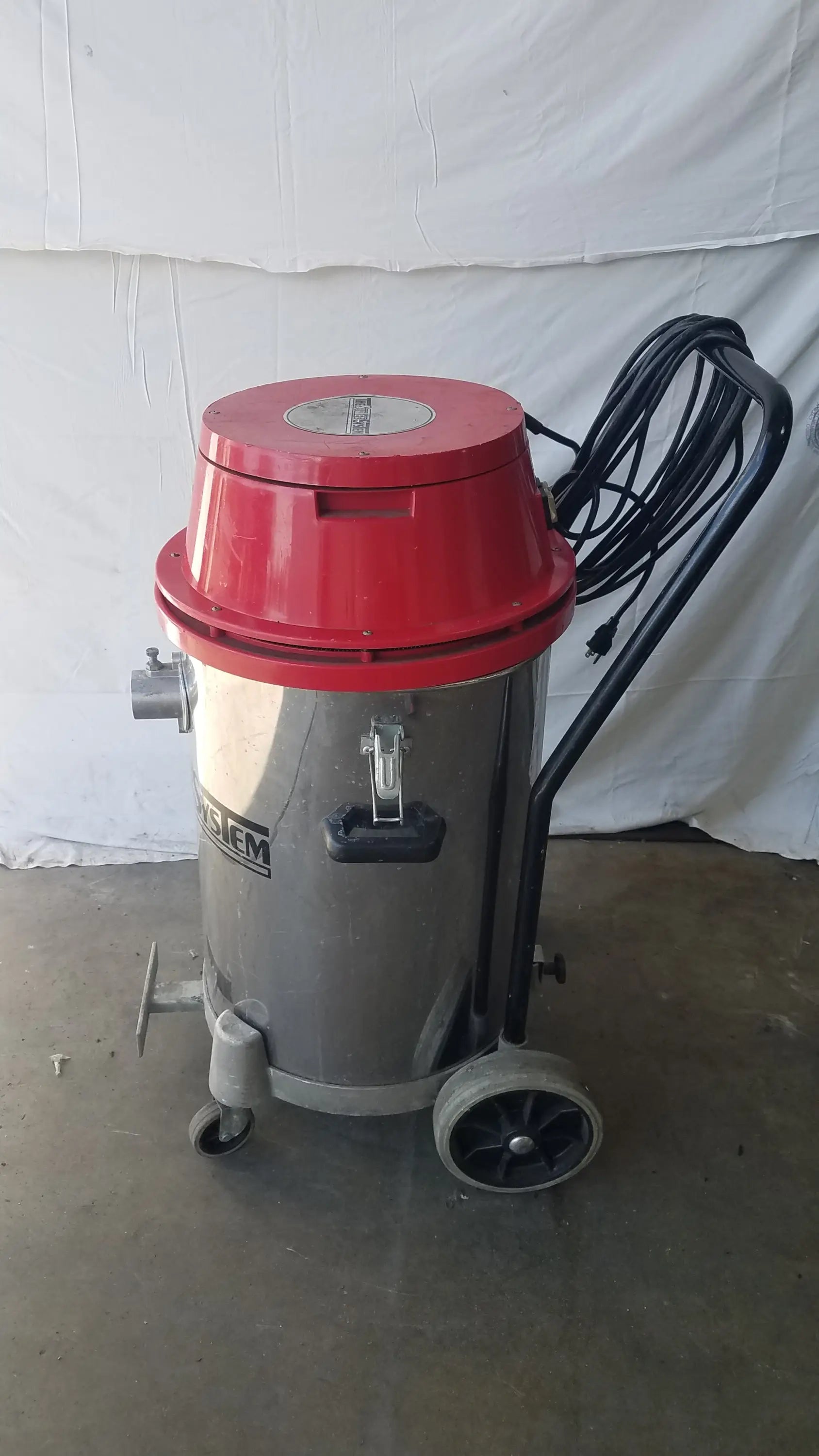 The surtec system 450m industrial red and silver wet dry drum vacuum cleaner with black handle and coiled hose