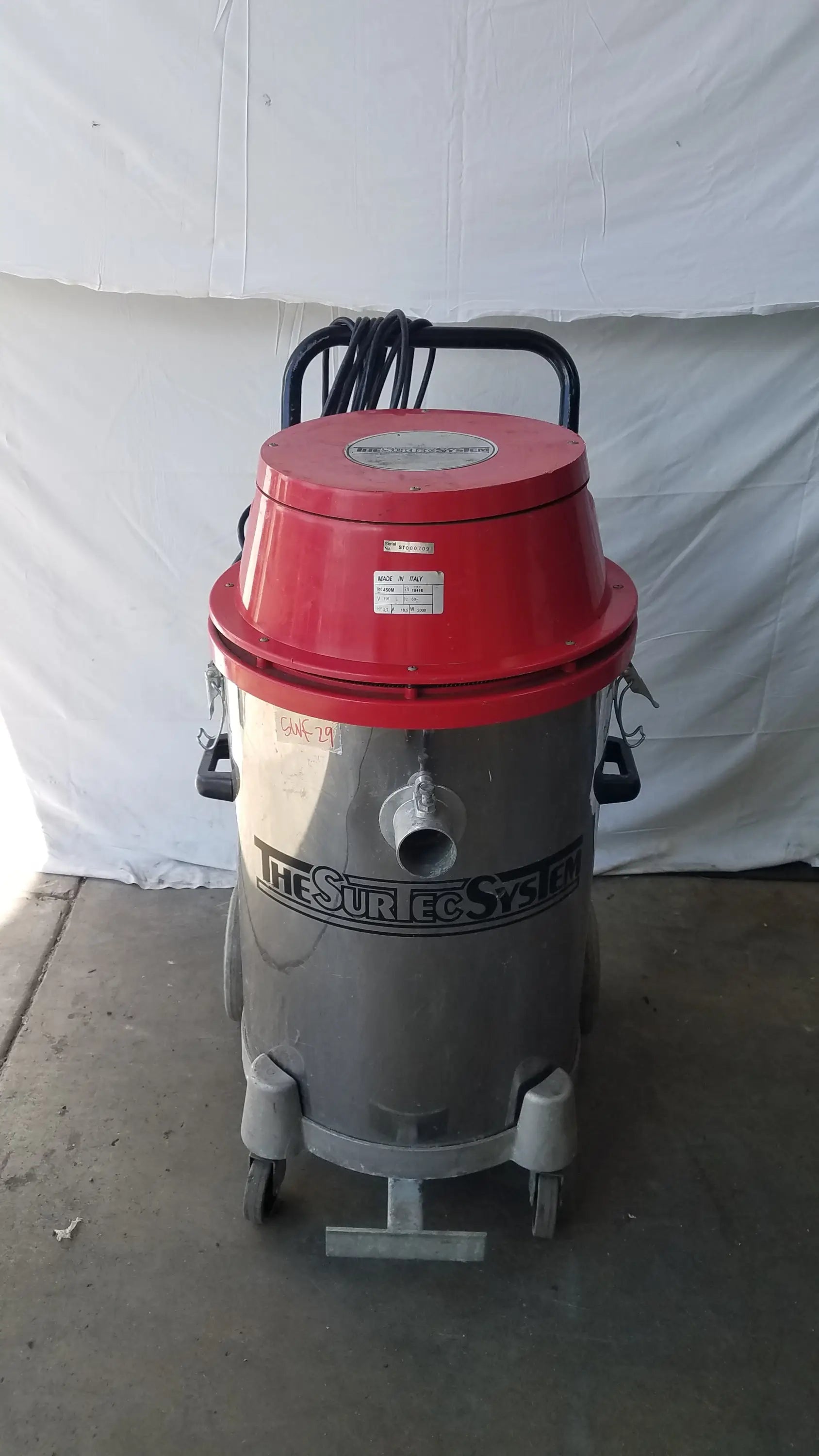 The surtec system 450m red and silver industrial wet dry drum vacuum cleaner with black handle and wheels