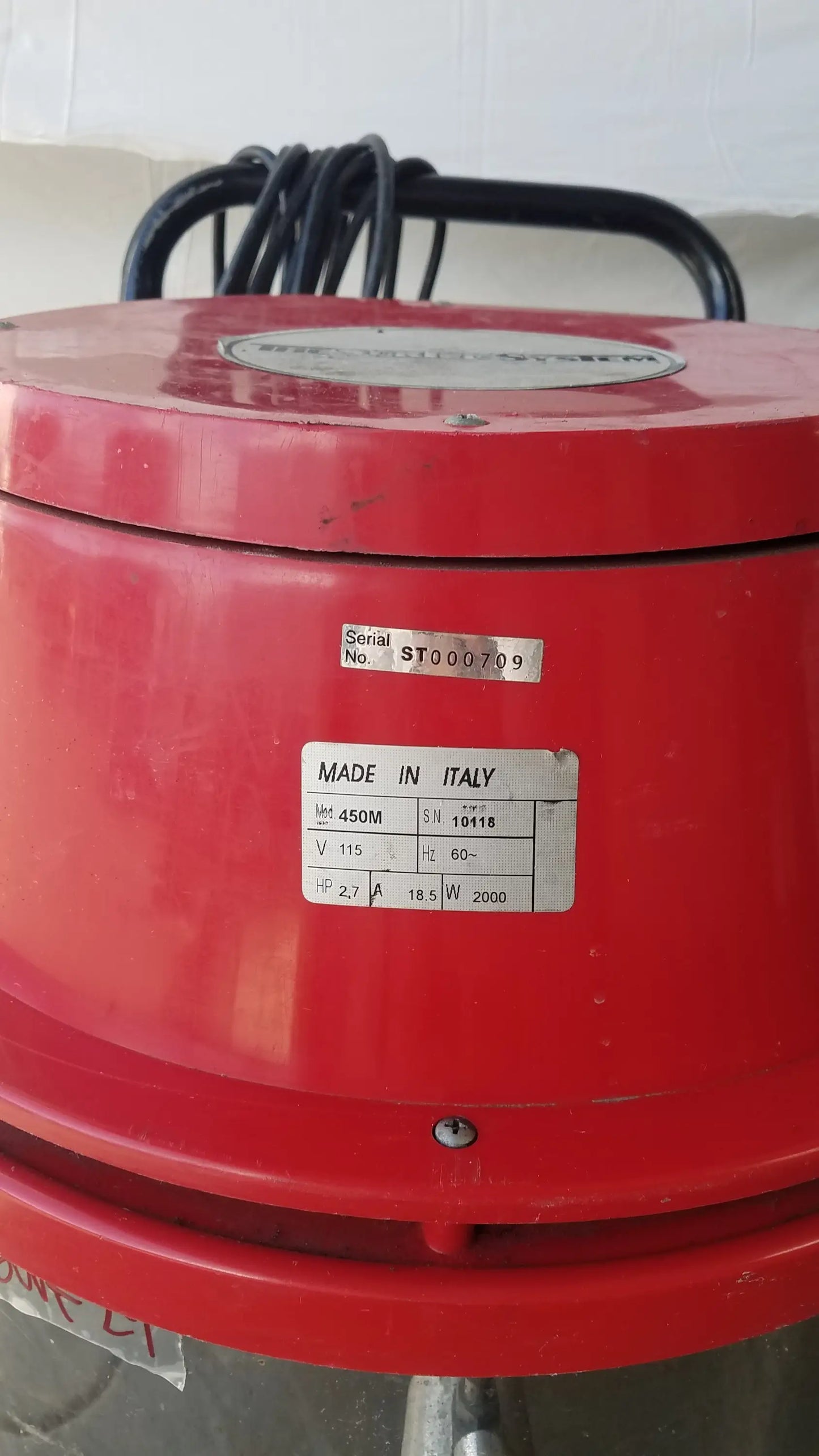 Red industrial electric motor with made in italy label mounted on black handle for the surtec system 450m wet dry drum vacuum