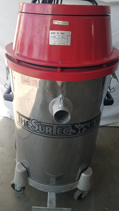 Red and silver industrial heavy duty wet dry drum vacuum cleaner with the surtec system branding on its cylindrical body
