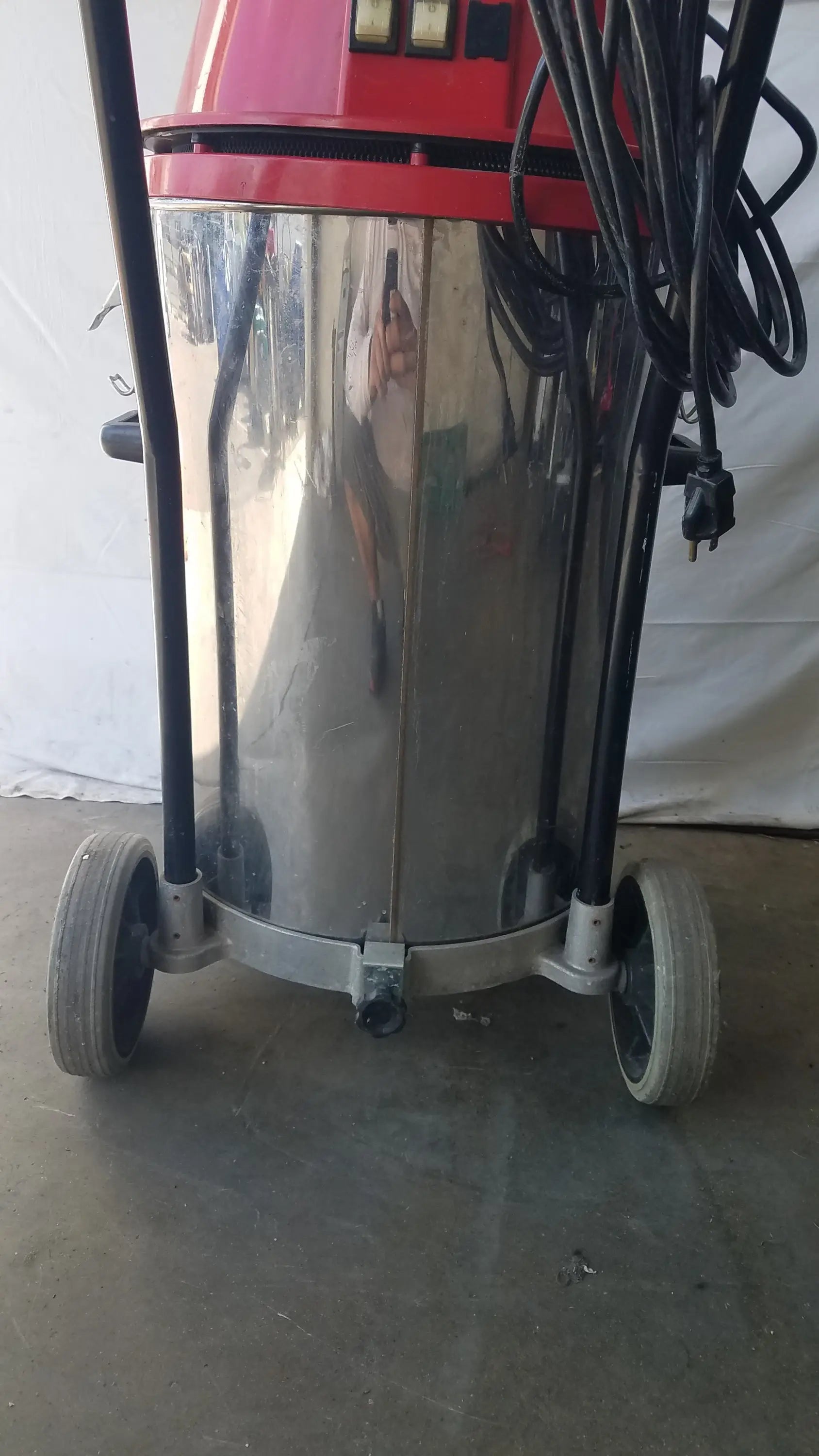 The surtec system 450m red and stainless steel wet dry drum vacuum cleaner with black hoses for industrial use