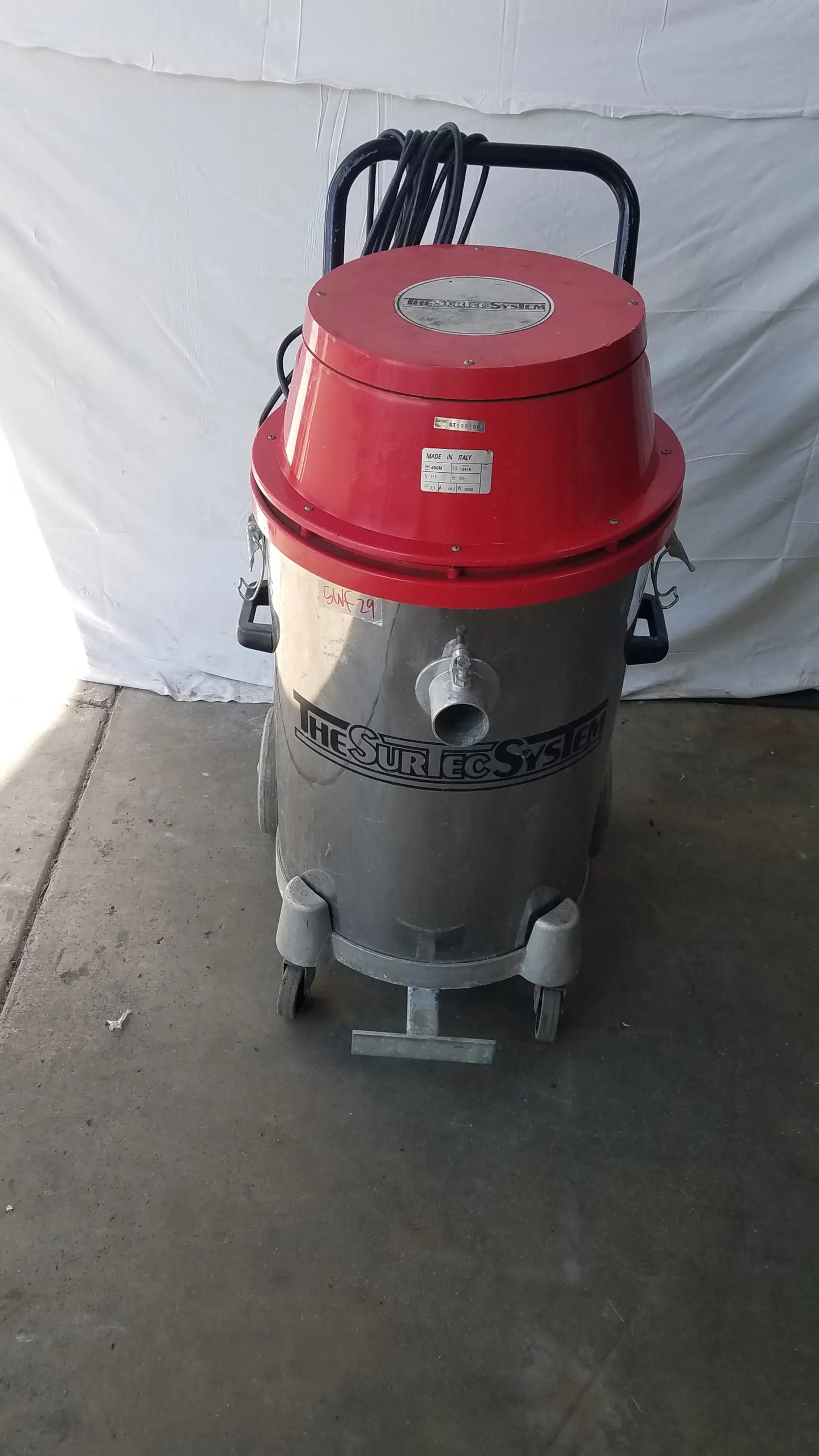 The surtec system 450m red and gray industrial wet dry drum vacuum cleaner with black handle and wheels