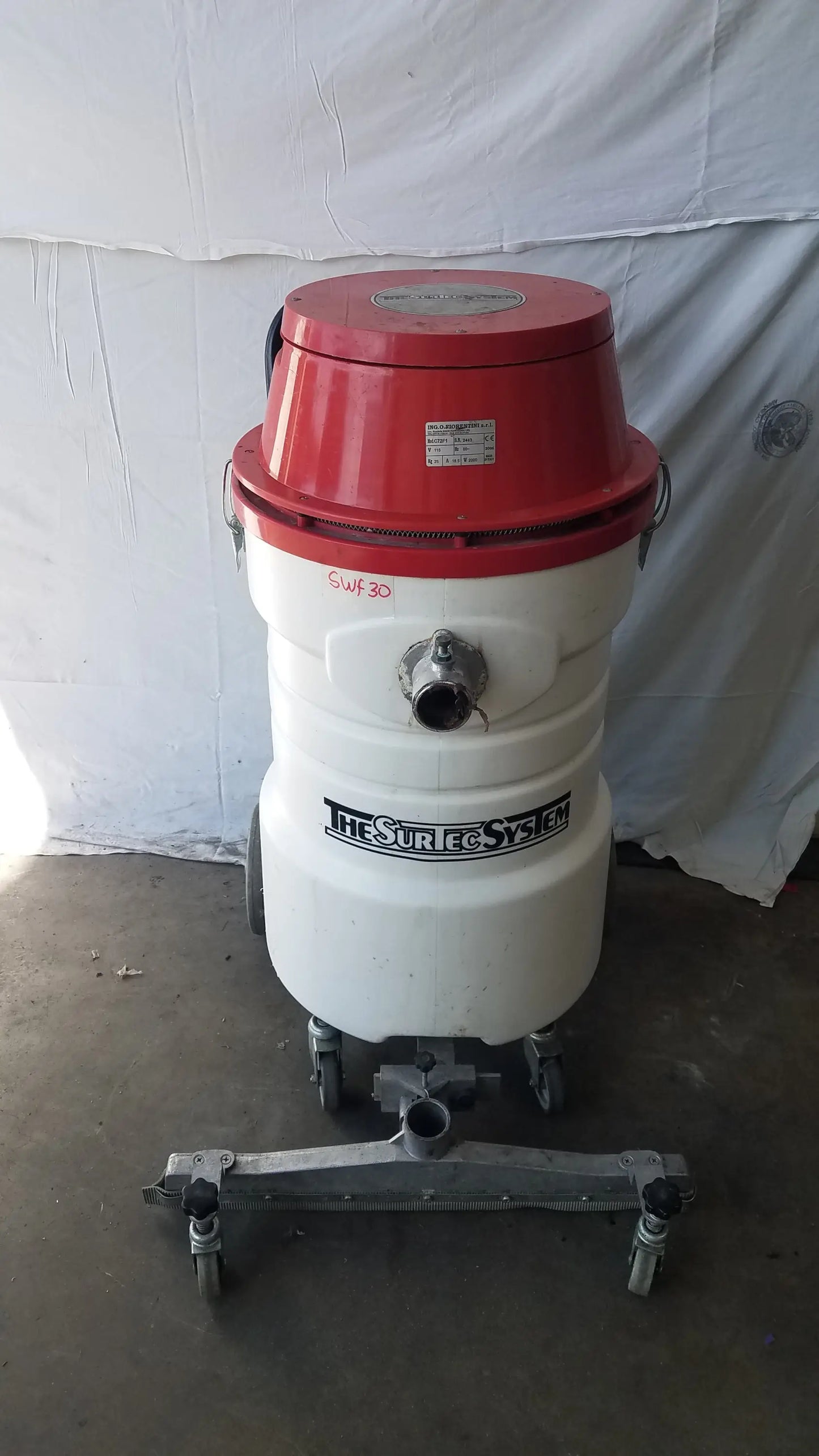 The Surtec System C72F1 red and white wet dry vacuum cleaner with cylindrical metal body and wheels 115V S/N 2443