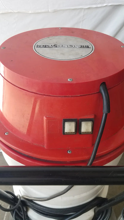 Red cylindrical industrial fan of the surtec system c72f1 wet dry vacuum cleaner with silver logo and control buttons