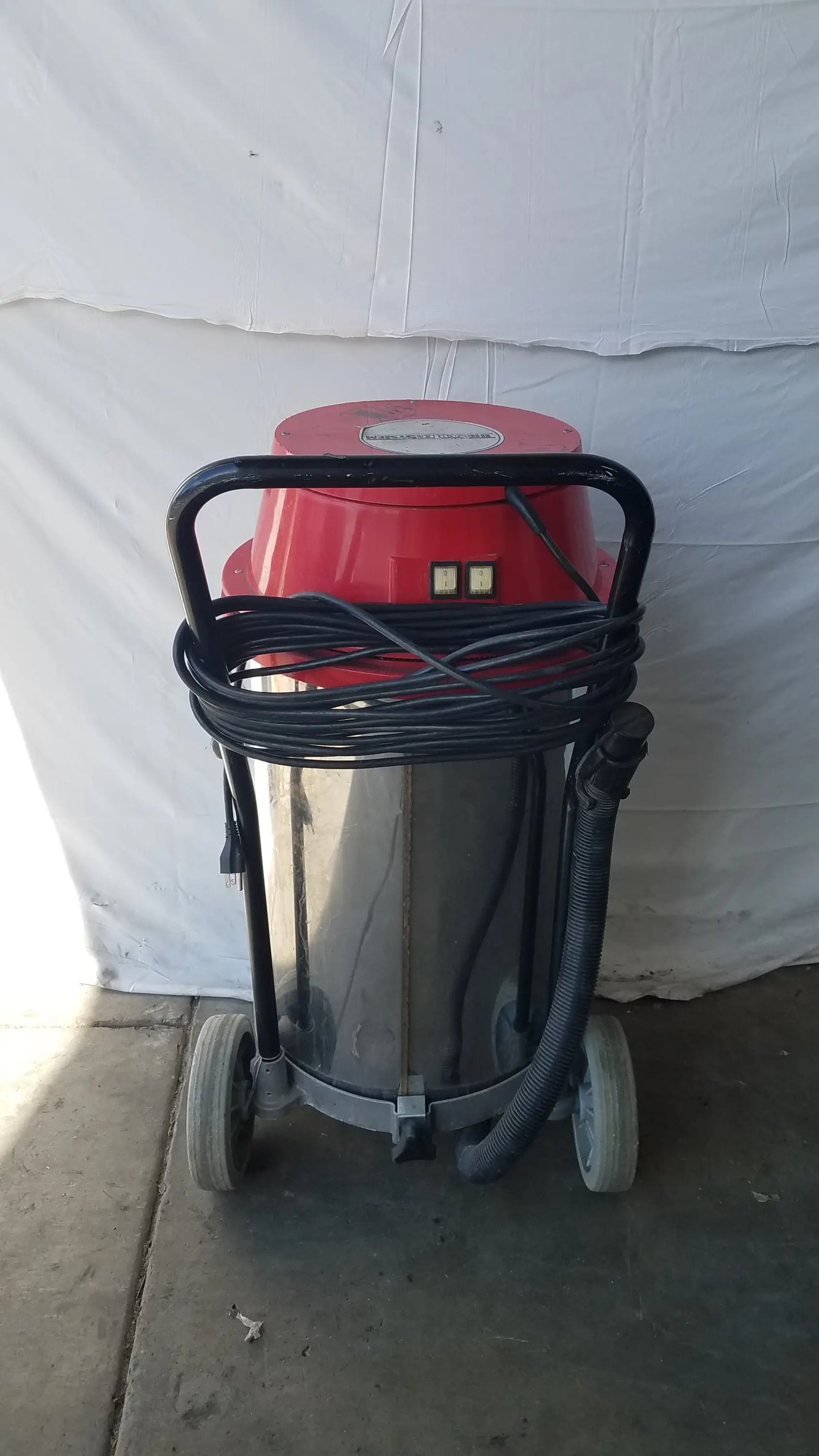The surtec system f46f red and stainless steel industrial wet dry drum vacuum cleaner with black handle hose and wheels