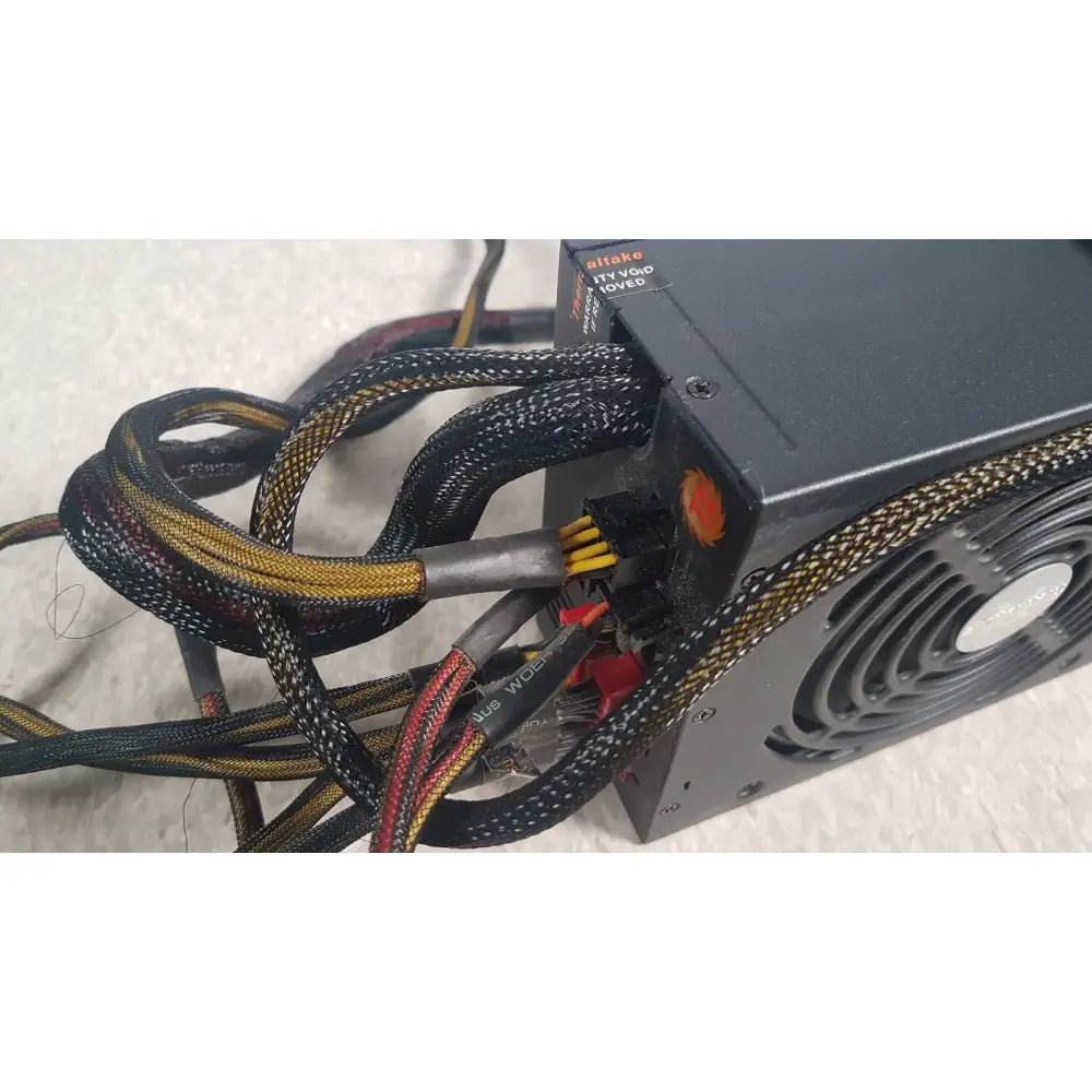 Black and gold braided power supply cable bundle with silver fan side of thermaltake 1350w toughpower gf3 1350w unit