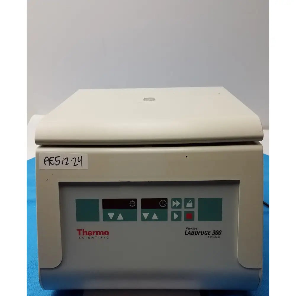 Beige thermo fisher heraeus labofuge 300 laboratory centrifuge with control panel featuring teal and black buttons