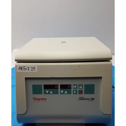 Beige thermo fisher heraeus labofuge 300 laboratory centrifuge with control panel featuring teal and black buttons