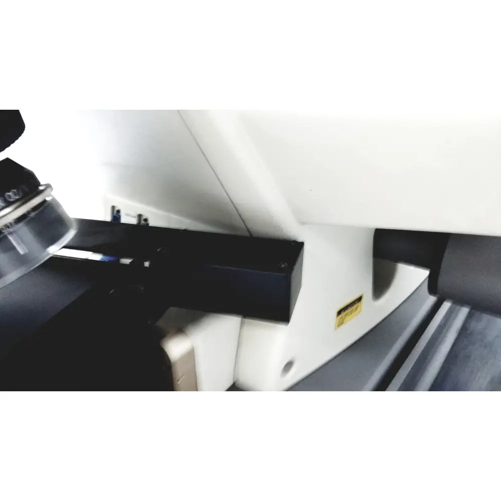 Black rectangular component mounted on white base of thermo nicolet continuum infrared microscope for precise analysis