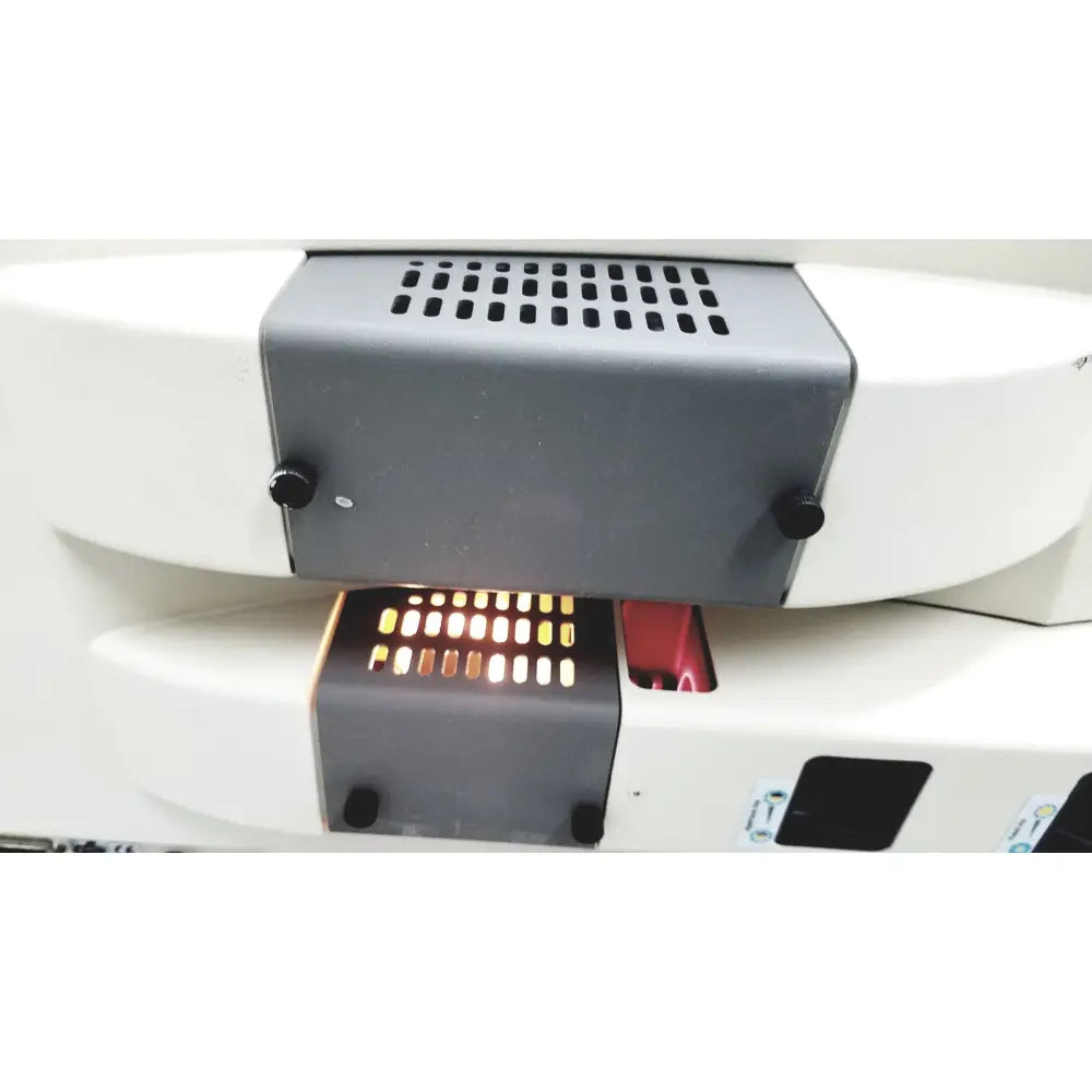 White and gray thermo nicolet continuum infrared microscope with perforated vent panel black knobs and illuminated display