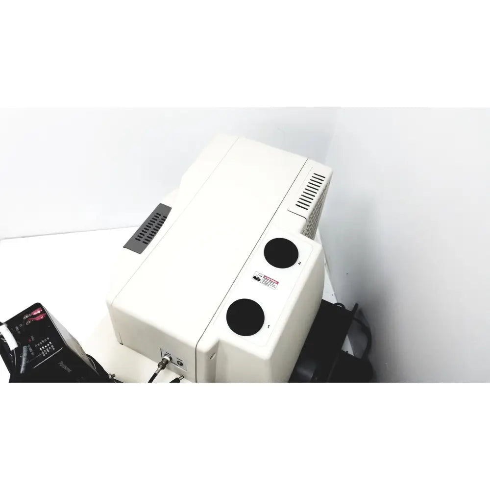 White rectangular thermo nicolet continuum infrared microscope with black circular ports and ventilation grilles back view