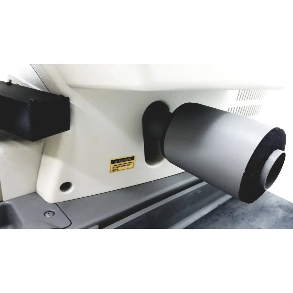 Gray cylindrical lens housing with black end caps mounted on white base of thermo nicolet continuum infrared microscope