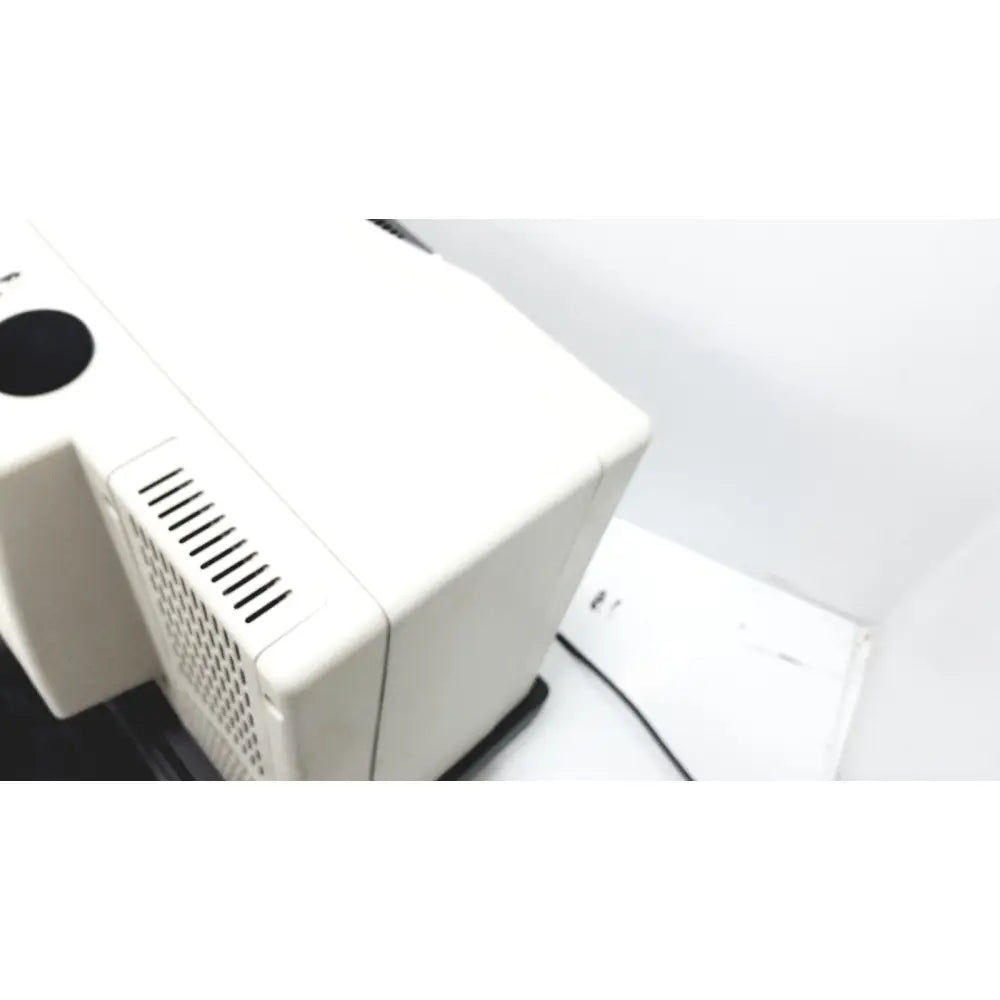 White rectangular thermo nicolet continuum infrared microscope case with black circular vent and slotted side grille