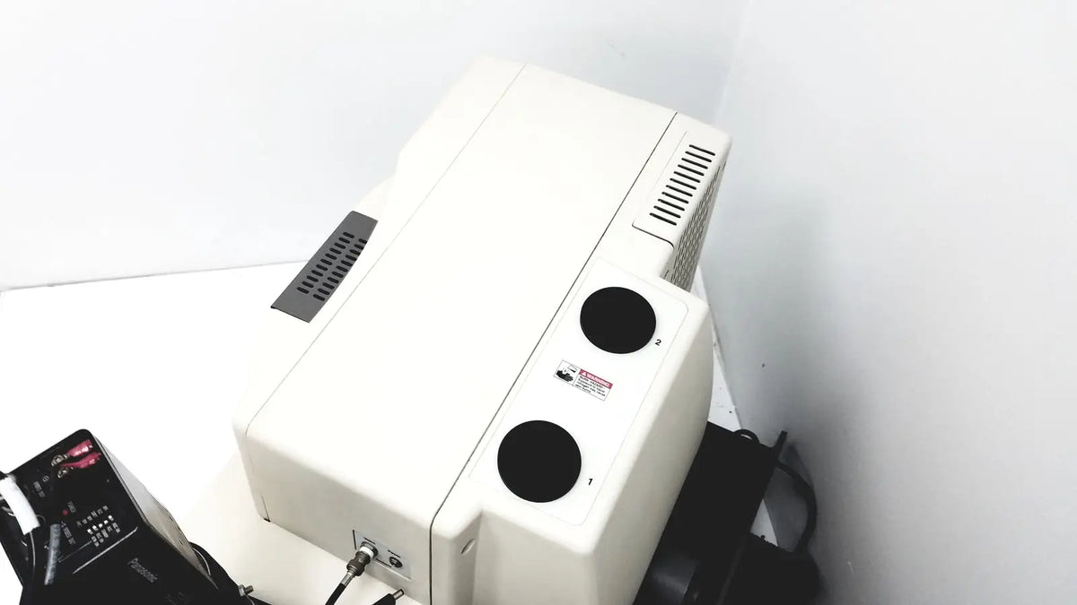 White rectangular thermo nicolet continuum infrared microscope with black circular ports and ventilation grilles back view