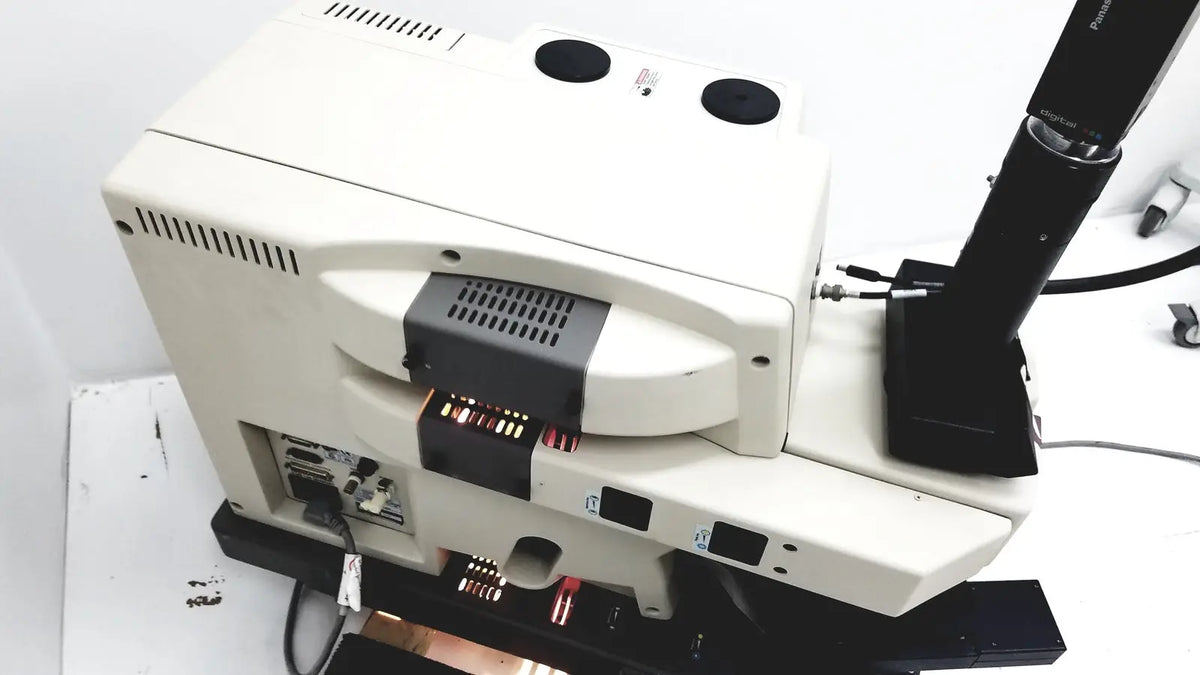 White and black thermo nicolet continuum infrared microscope with modern design ventilation slots and multiple base ports