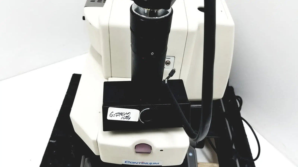 White and black thermo nicolet continuum infrared microscope with labeled stage plate for precise sample analysis